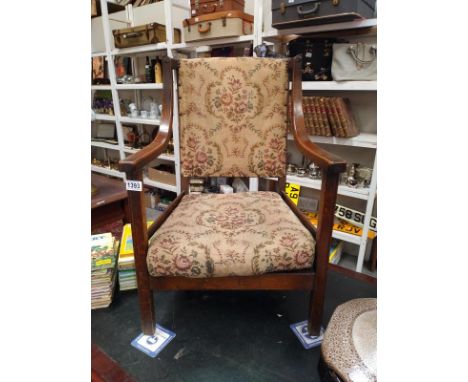 A 1930's oak arm chair with tapestry seat. COLLECT ONLY.