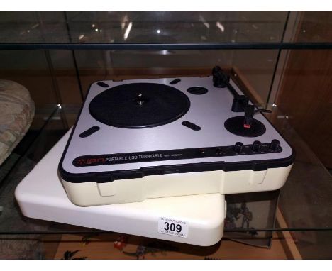An Ion portable USB turntable with case*Condition report: Speaker is inbuilt into system but requires a 12volt mains plug. 