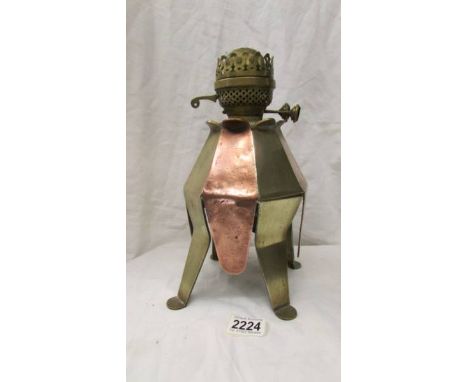 An unusual arts and crafts copper and brass oil lamp.