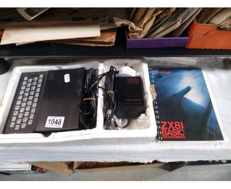 A ZX81 computer with manual (original polystyrene packaging but no sleeve)