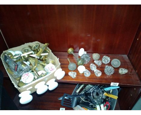 A shelf of door knobs