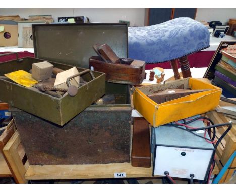 A mix of woodwork tools, planes and an auto charger for batteries