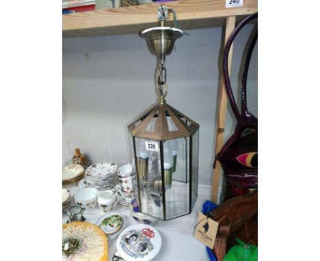 An octagonal glass 3 bulb LED ceiling light with fittings.
