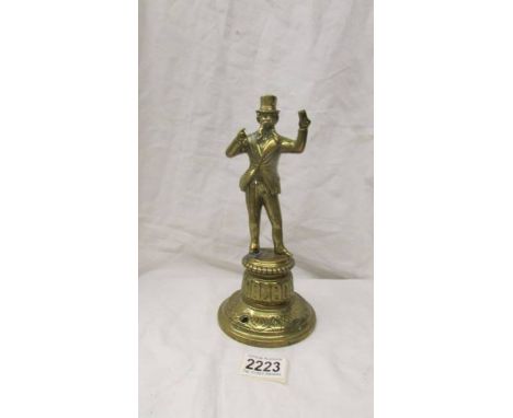 A Victorian brass gas bar lighter of a gentleman in a tip hat, 24 cm.