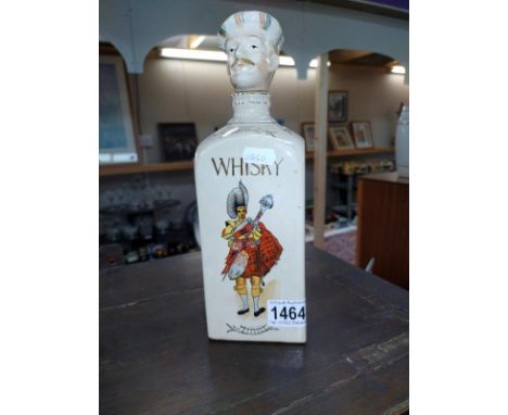 A novelty vintage pottery musical Scotsman whiskey decanter