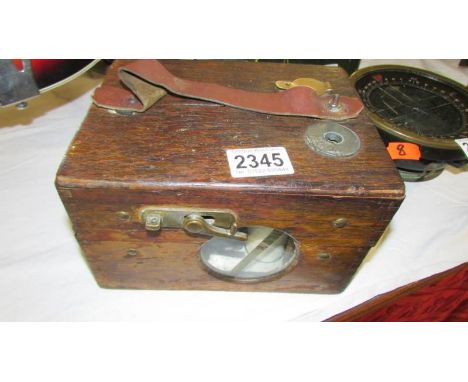 A cased pigeon clock.