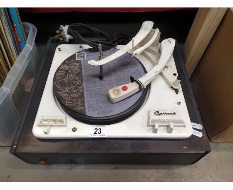 A vintage Garrard record player*Condition report: Turns on and turns at appropriate speeds. No speakers.
