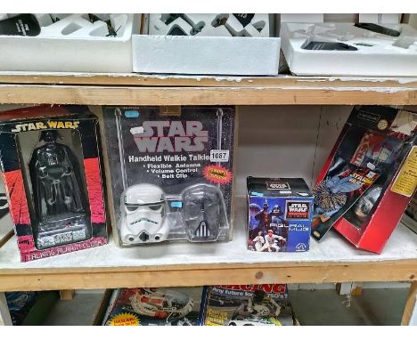 A quantity of vintage STar Wars items all in packaging including walkie talkies and alarm clock.