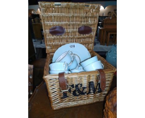 A F&amp;M picnic basket with a Colclough tea set.