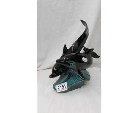 A group of two Poole pottery dolphins.
