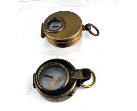 Military. A WWII brass compass by Elliott Bros. and a similar compass (2)