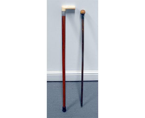 An Ivory handled Malacca walking stick with white metal collar 96cm high and a silver mounted ivory handled walking stick 92c