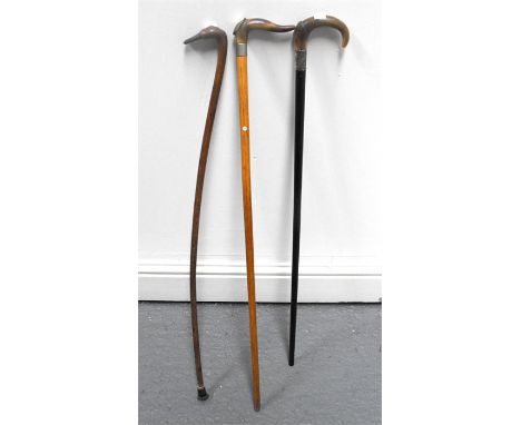 An Edwardian Horn Handled Ebony walking stick with silver mount 85cm high another horn handled stick 88cm high and a 19thC fo