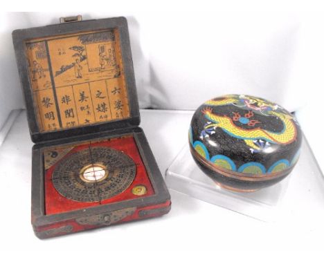 A Chinese Cloisonné lidded bowl, decorated a dragon, 13cm diameter and a Chinese table compass (2)  