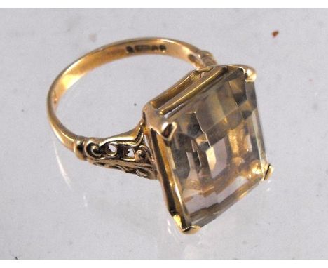 A 9ct gold ring set with a large smokey quartz 