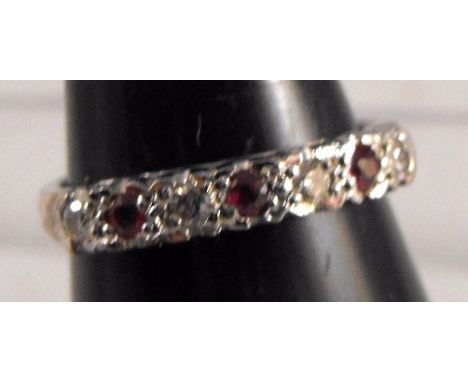 An 18ct white gold ruby and diamond ring