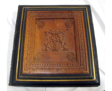 A Victorian grand tour scrap book containing various architectural photos, leather bound with inset carved walnut Egyptian re