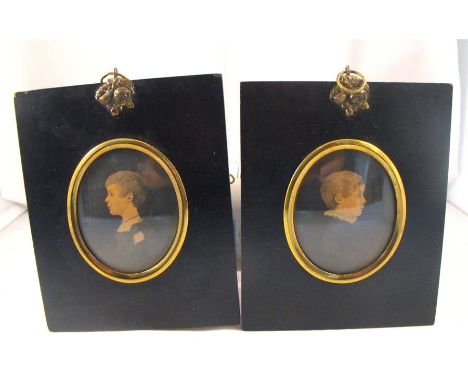 A Pair of Portrait Miniatures of a young girl and a young boy mounted in ebonised frames. 5cm x 6cm  