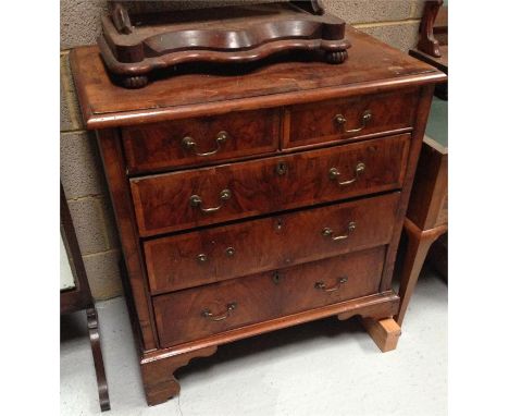 An 18th C style figured walnut chest with two short draws above three long, standing on bracket feet 84cm (AF)