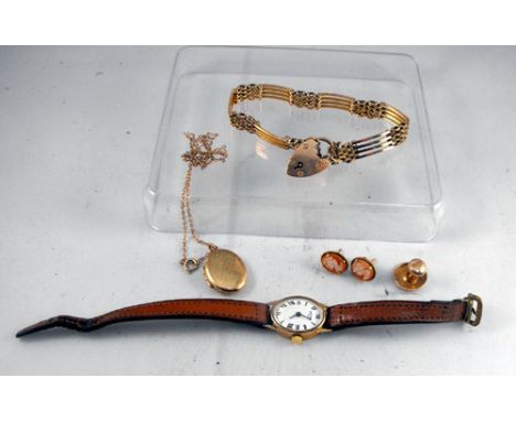 A 9ct gold gate bracelet, a 9ct gold locket and chain, a pair of cameo earings, a ladies gold watch and a dress stud.