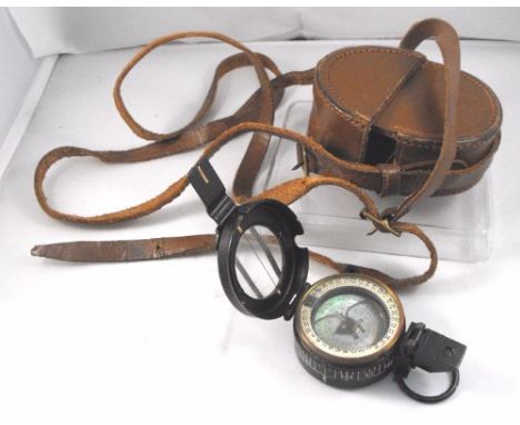 A leather cased oil filled marching compass by Stanley 