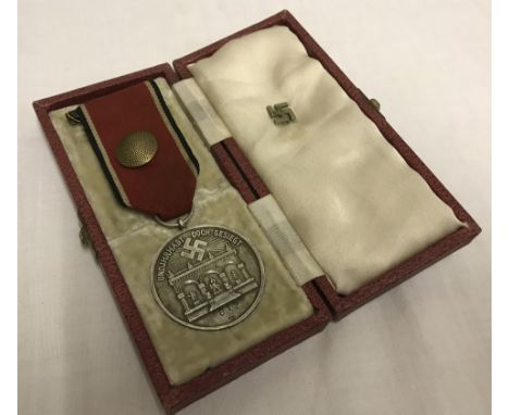 A cased German WWII pattern Blood Order for the 1923 Putsch. Numbered 812, marked 800. With Lapel stick pin badge. 