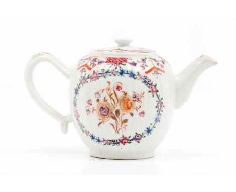 A teapot with coverChinese export porcelainPolychrome floral "Famille Rose" enamelled decoration Mould decoration to spout an