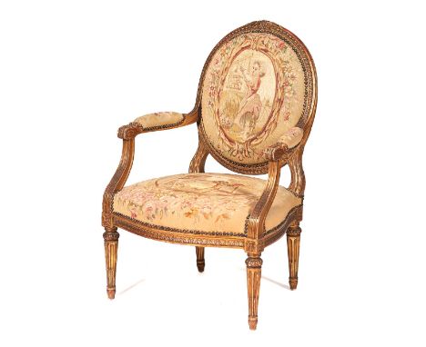 A Louis XVI style fauteuilGilt wood of carved decoration and Aubusson tapestry style upholstery(minor losses and faults)
