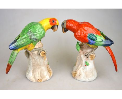 A pair of Dresden models of parrots, each perched on a tree trunk, 20th century, 19.5 cm h. (2) Condition Report Both good co