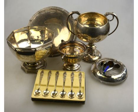 A silver dish on raised foot, London 1933, to/w three trophy cups, Birmingham 1929, 1936 and Sheffield 1922, 33.5 oz total, t