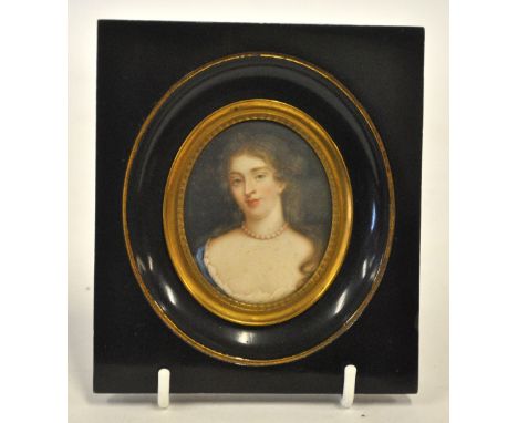 A Georgian oval portrait miniature of a young lady with pearl necklace and plunging neckline, inscribed on reverse '26 Miss R