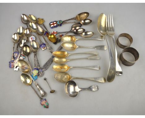 A 19th century American sterling table spoon, a George III fiddle and shell caddy spoon with engraved bowl (repaired stem), L