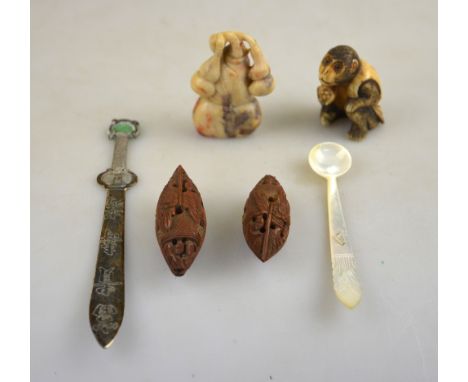 A Chinese soapstone carving of a gourd, 4.8 cm long to/w two small nuts carved as Sampans with opening windows, a Japanese bo