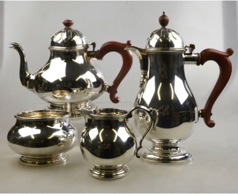 A heavy quality silver four-piece tea service including hot water jug, baluster form with domed covers, Z. Barraclough & Sons