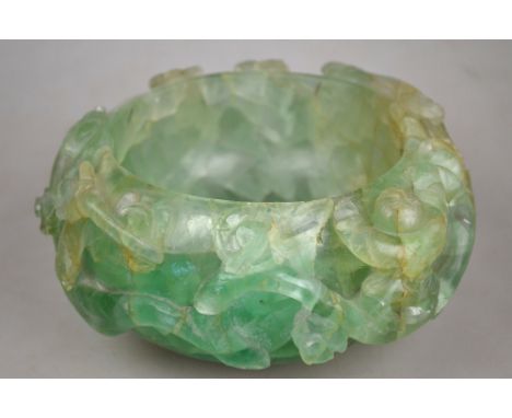 A Chinese rock crystal bowl carved with a boy and a continuous floral scroll, 19th century, 16.5 cm diam Condition Report Sma
