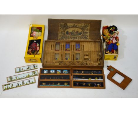 A boxed set of 'Improved Swiss Bricks' building blocks, to/w a collection of novelty magic lantern slides and three Pelham pu