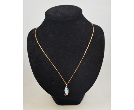 A contemporary style opal pendant set with eight-cut diamonds and stamped 14k 585 on 9ct yellow gold curb necklet chain