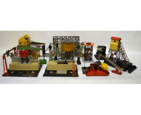 A large collection of 1950s and later Lionel Trains accessories including 2 x No. 394 Rotary Beacon Towers, No. 30 Water Towe