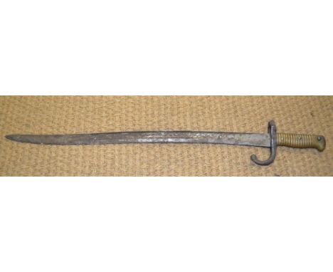 A 19th century French bayonet with 57 cm recurved blade and ribbed brass grip Condition Report Lacks scabbard, blade rusted