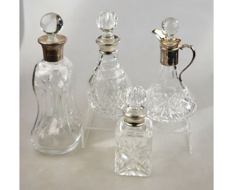 A glass 'glug-glug' decanter with silver collar, to/w three other decanters, also with silver collars (4) Condition Report no