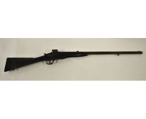 An antique sporting gun with hammer lock and obsolete breech and lever action,barrel stamped 'W.R.E.1 G',  barrel 71 cm long 