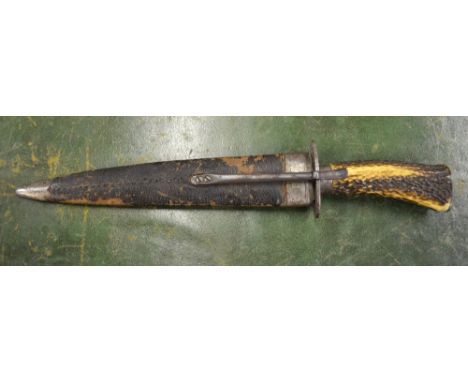 A 19th century hunting knife with 25 cm double-edge Damascus-finish blade, antler grip and leather scabbard Condition Report 