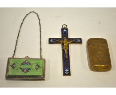 An enamelled pewter crucifix, a brass vesta case embossed with the 1893 World's Fair Administration building and a chrome and