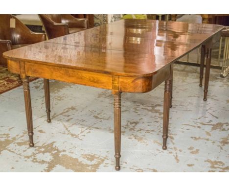 DINING TABLE, late George III mahogany, in the manner of Gillows composing of two D and gateleg sections, on reeded tapering 