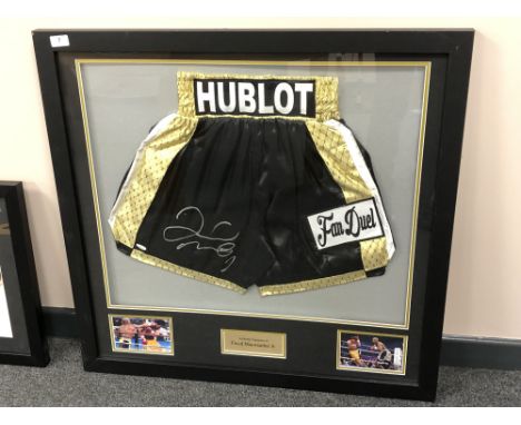 A sporting memorabilia montage : A signed pair of boxing shorts, Floyd Mayweather Jr., with certificate of authenticity from 