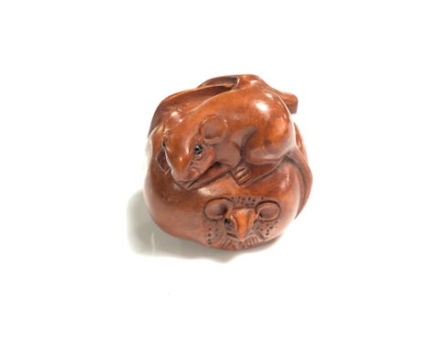 A carved Chinese hardwood netsuke - Two rats in a fruit 