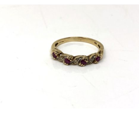 A 9ct gold ruby and diamond half eternity ring, size O.  CONDITION REPORT: 2.2g