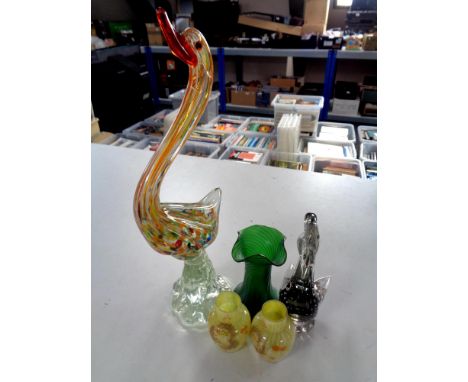 Five pieces of glassware to include two Venetian glass bird ornaments, an iridescent green glass vase and a pair of hand pain