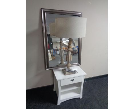 A contemporary bedside table fitted a drawer together with a silver framed mirror and a wooden table lamp with shade 