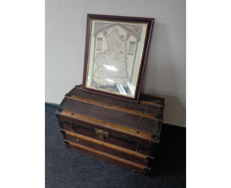 An early 20th century wooden bound dome topped Drawco trunk together with a framed map of Northumberland (as found) 